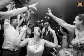 At Château des Selves in Seillans, France, the bride dances during the reception beneath guests holding hands in the shape of a heart.